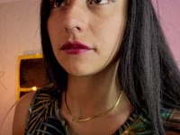 A brunette girl with soft, radiant skin, a slim body that moves with grace and energy. Her black, straight, shiny hair falls in soft waves over her shoulders, highlighting her lively face. She has a warm and contagious smile that lights up her expression and reflects her cheerful and laughing personality. Her attitude is determined and confident, always with a spark of confidence that is noticeable in her bearing and the way she interacts with others. She has a lively look that shows her enthusiasm for life, leaving an impression of freshness and positivity wherever she goes.